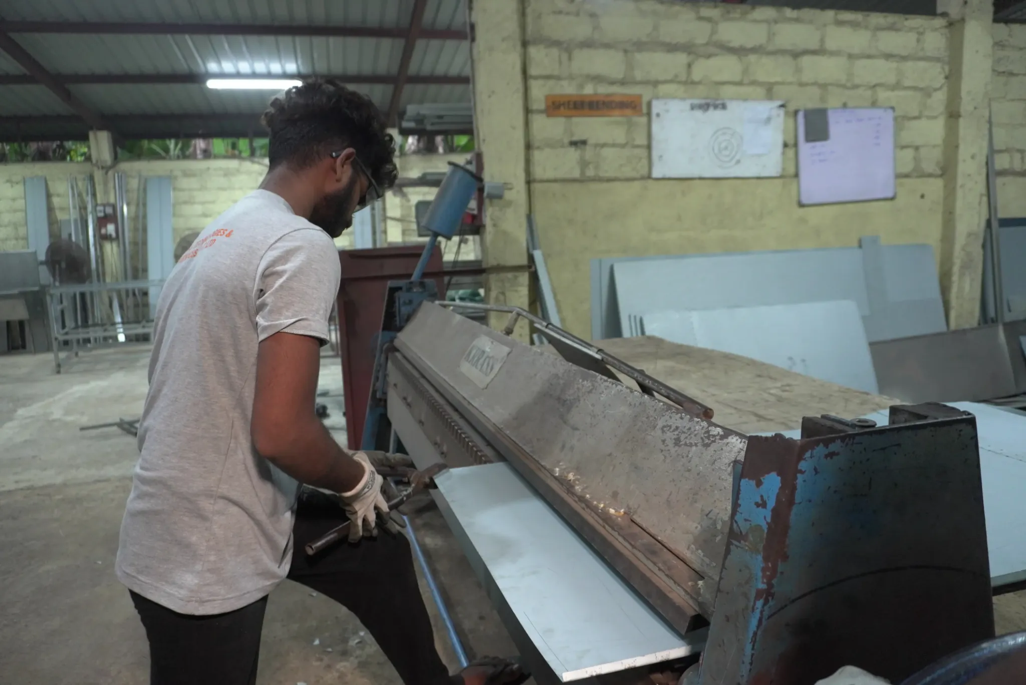 A technician servicing a machine